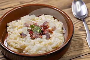 Slovakian halusky served with sheep cheese and roasted bacon