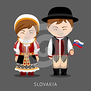 Slovaks in national dress with a flag. photo
