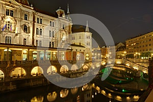 Slovenia, Ljubljana by night - Triple bridge over river Ljubljanica