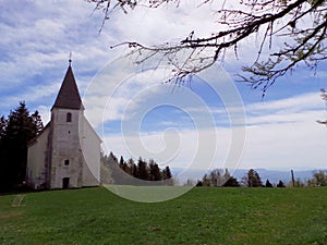 Slovenia Pohorje Areh old church on meadow forest photo