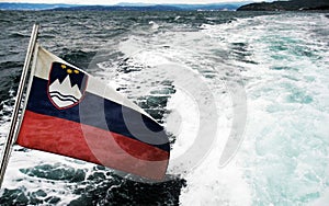 Slovenian flag at the sea