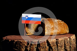Slovenian flag on a stump with bread