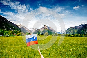 Slovenian landscape with flag photo