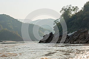 Slow boat cruise on the Mekong River. Popular tourist adventure trip by slow boat from Huay Xai to Luang Prabang.