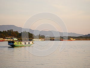 slow boat cruising along the Mekong River, Local boat moving on Mekong river