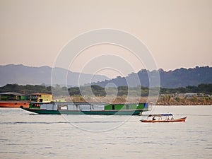 slow boat cruising along the Mekong River, Local boat moving on Mekong river