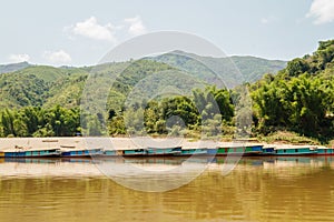 Slow boats on Mekong River in Northern Laos.