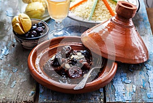 Slow cooked beef with prunes, figs, raisins and almonds - moroccan tajine.