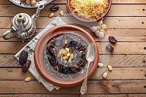 Slow cooked beef tajine with dates, raisins and almonds - moroccan cuisine, copy space