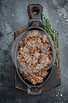 Slow cooked kawurma with shredded and diced beef chunks highlighting protein breakdown, caramelized surfaces and rustic