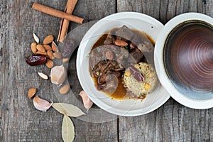 Slow cooked lamb with potato and dates served with warm couscous and chickpeas