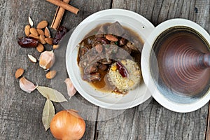 Slow cooked lamb with potato and dates served with warm couscous and chickpeas