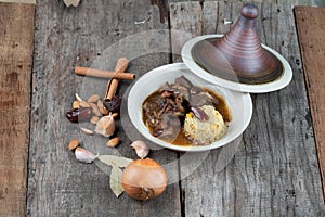 Slow cooked lamb with potato and dates served with warm couscous and chickpeas