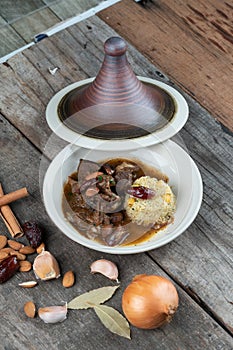 Slow cooked lamb with potato and dates served with warm couscous and chickpeas