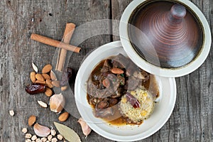 Slow cooked lamb with potato and dates served with warm couscous and chickpeas