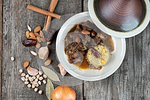 Slow cooked lamb with potato and dates served with warm couscous and chickpeas