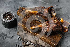 Slow Cooked Lamb Shanks meat, on gray stone table background