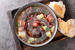 Slow Cooked Portuguese Stone Soup or Sopa da Pedra closeup in the plate. Horizontal top view