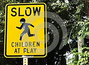 Slow down children at play sign