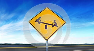 Slow Down Children Playing Symbol - Yellow Road Sign Isolated on Sky Background with Room for Copy