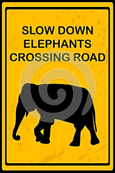 Slow Down Elephants Crossing Road sign