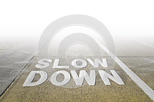 Slow Down sign on a footpath.