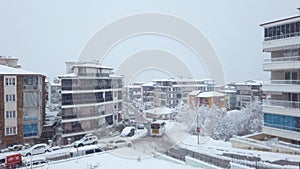 A slow, drone-like ascent captures a snowy day in Denizli, Turkey