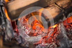Slow Fire with glow and ember, closeup of burning wood. Dangerous fire