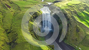 Slow motion aerial view of majestic waterfall. Skogafoss waterfall, Iceland