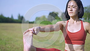 Slow motion Asian chinese female yoga yogi single leg balance pose