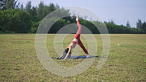 Slow motion Asian chinese female yoga yogi stretching in morning sun singapore