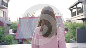 Slow motion - Asian tourist woman feeling happy traveling in Beijing, China.