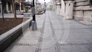 Slow motion blurred video on city street. Urban alley. Empty crosswalk. distance