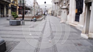 Slow motion blurred video on city street. Urban alley. Empty crosswalk. distance