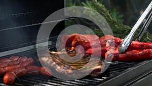 Slow motion chef cooking delicious red pepper and a ribs pork on barbecue.