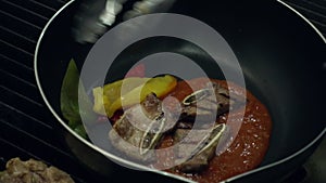 Slow motion - Chefs is preparing and cooking food at the kitchen of a restaurant