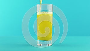 Slow motion close-up shot of fruit fizzy orange soda cold beverage drink pooring into low glass blue background in