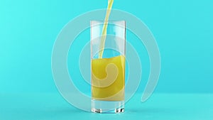 Slow motion close-up shot of fruit orange multifruit juice cold beverage drink pooring into glass blue background in