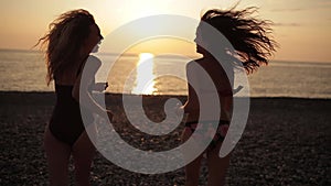 Slow motion: Close up Women friends running enjoy life playing and freedom beach at sunset, Attractive together of