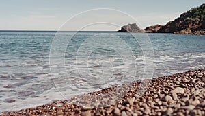 Slow motion closeup shot of clear sea water on Saint Raphael beach