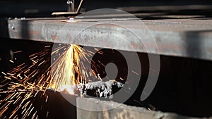 Slow motion: cutting a metal by cnc gas machine with sparks