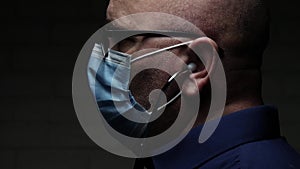 Slow Motion with Doctor Protected with Face Mask and Gloves Against Viruses Using a Stethoscope for Medical Consultation in a Resp