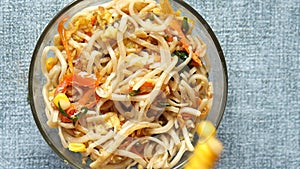 slow motion of dropping cron in Noodles in a bowl