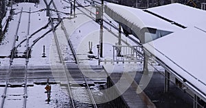 A slow motion of falling snow at the station in Tokyo