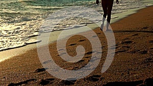 Slow motion feet walking in morning on beaches sea sand