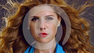 Slow motion flying hair and woman face with hypnosis look