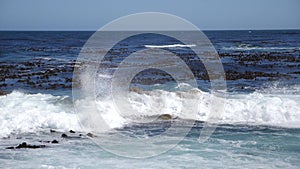 Slow motion footage of wave breaking on Rocky cliffs, Cape Peninsula, Cape Town