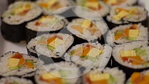 Slow Motion of homemade rolled sushi. Nori roll with rice seeweed and fish.