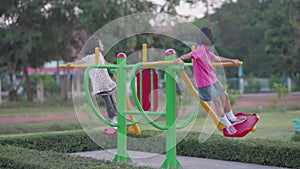 Slow motion kids running and playing in playground