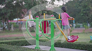 Slow motion kids running and playing in playground